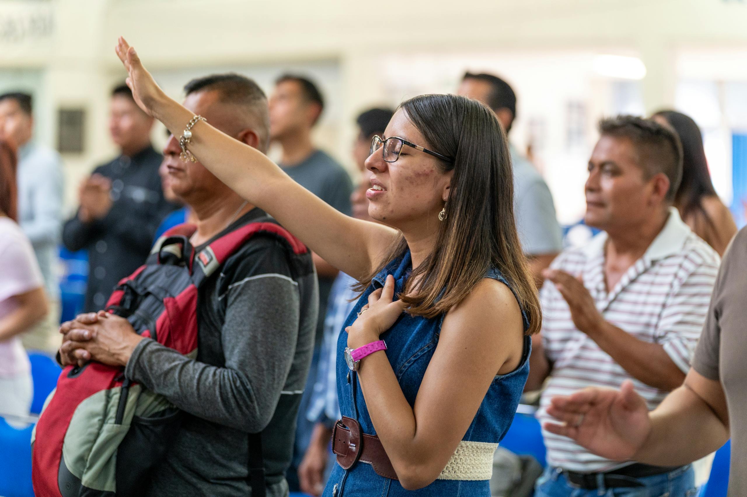 People engaged in worship during a church service.