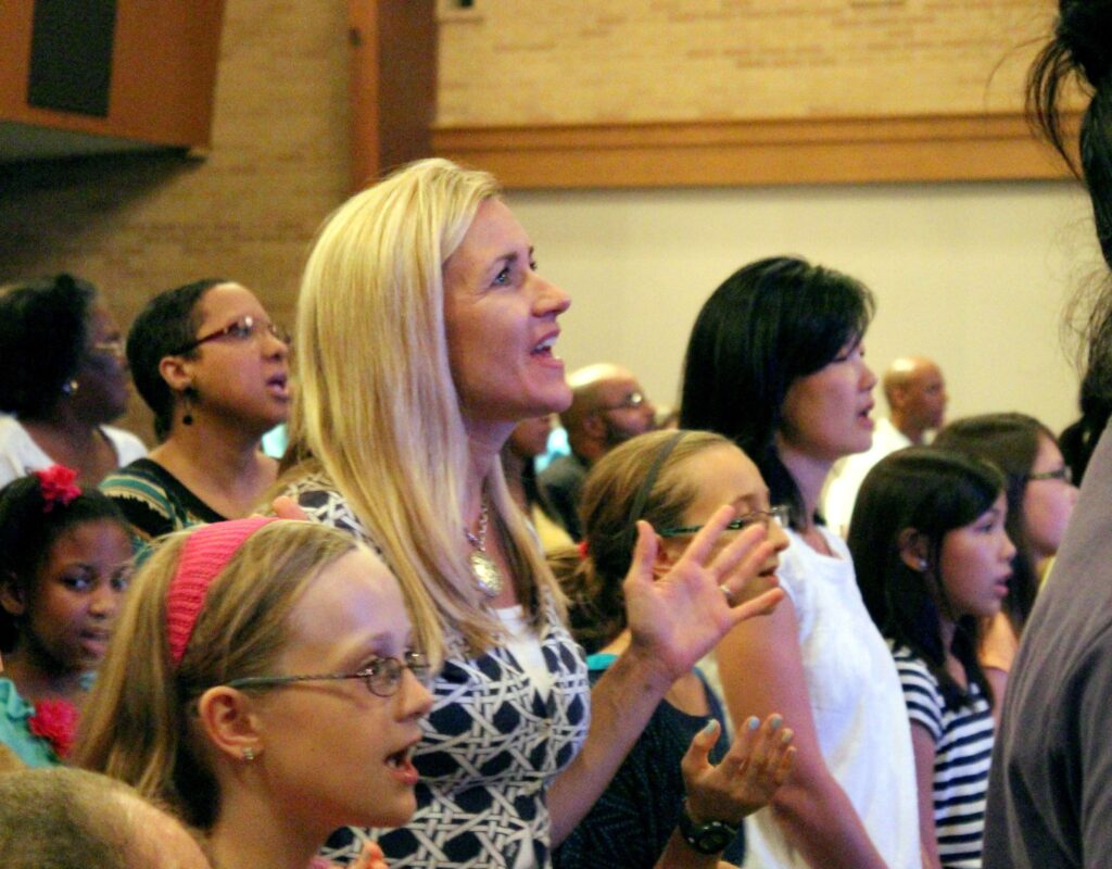Families participating in multi-cultural church service.