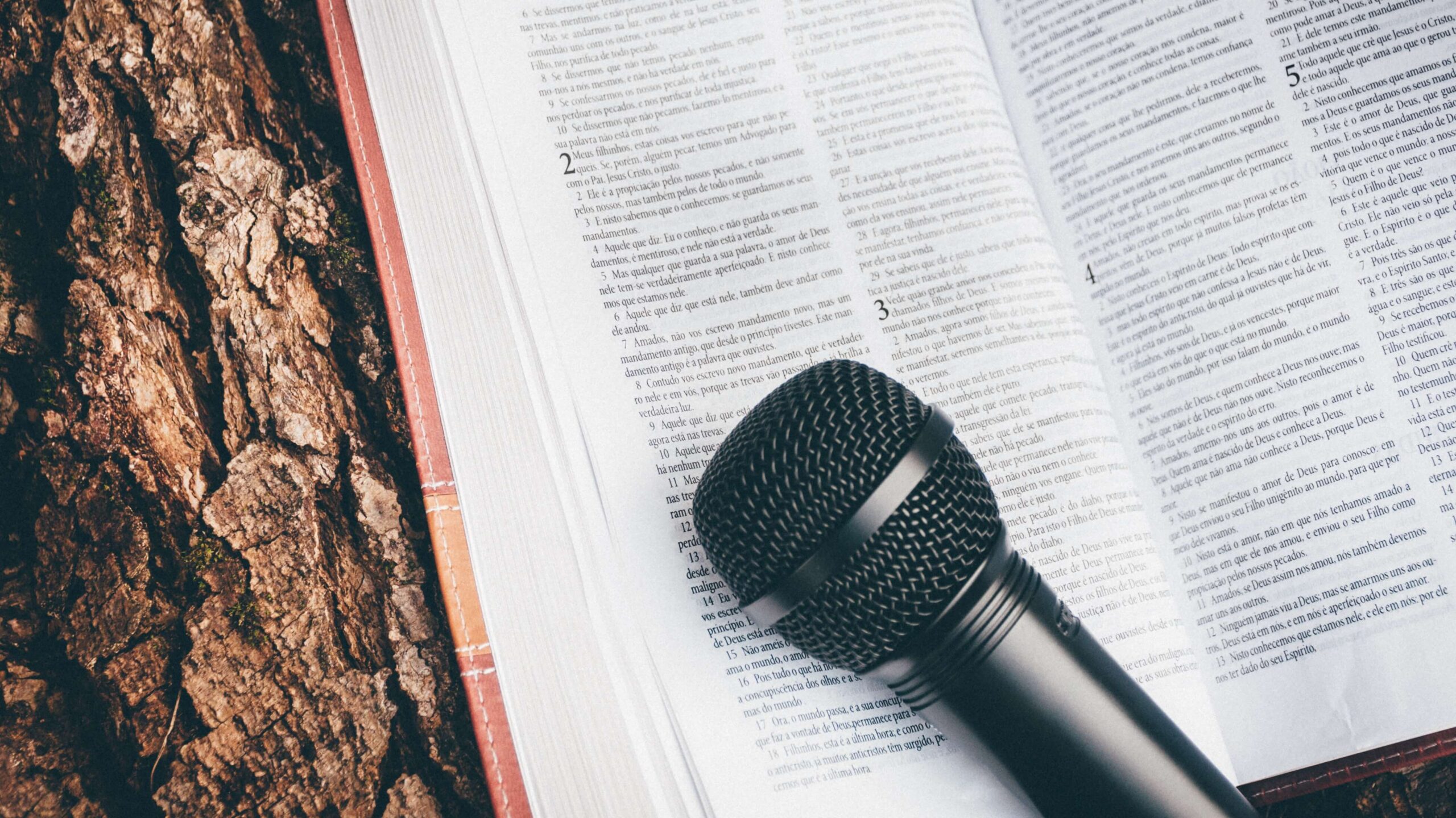 Microphone on open Bible